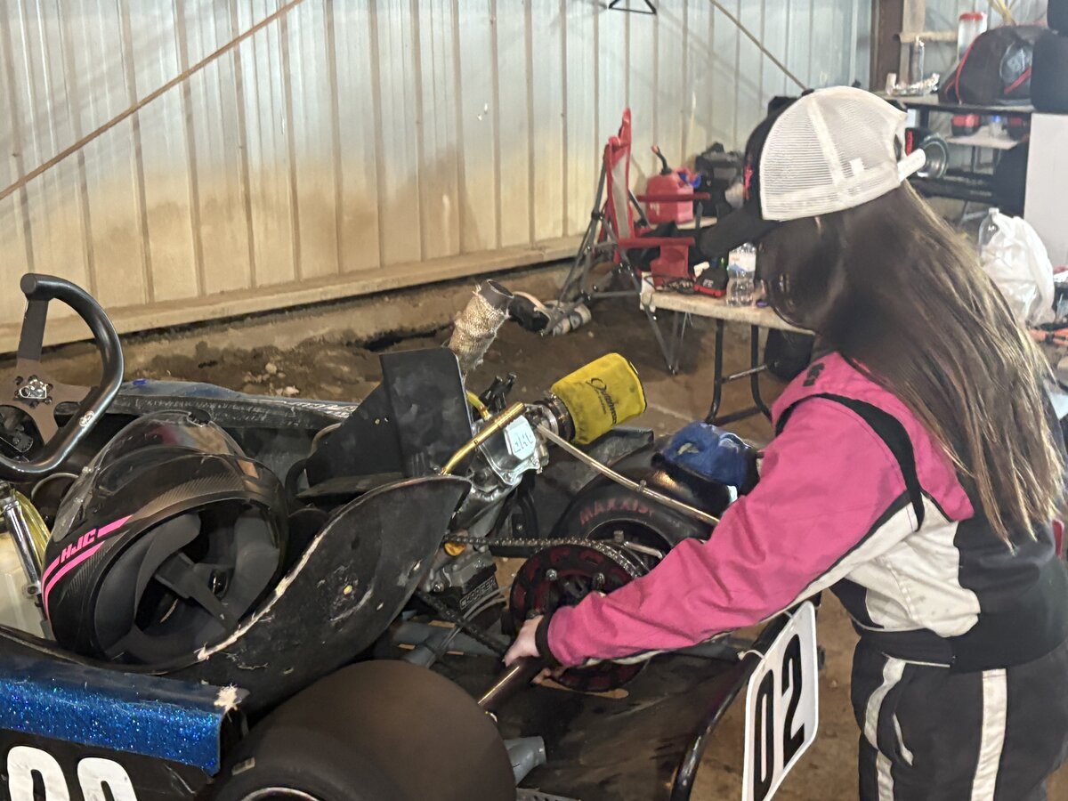 Madison in kart 02 in pit lane wide shot